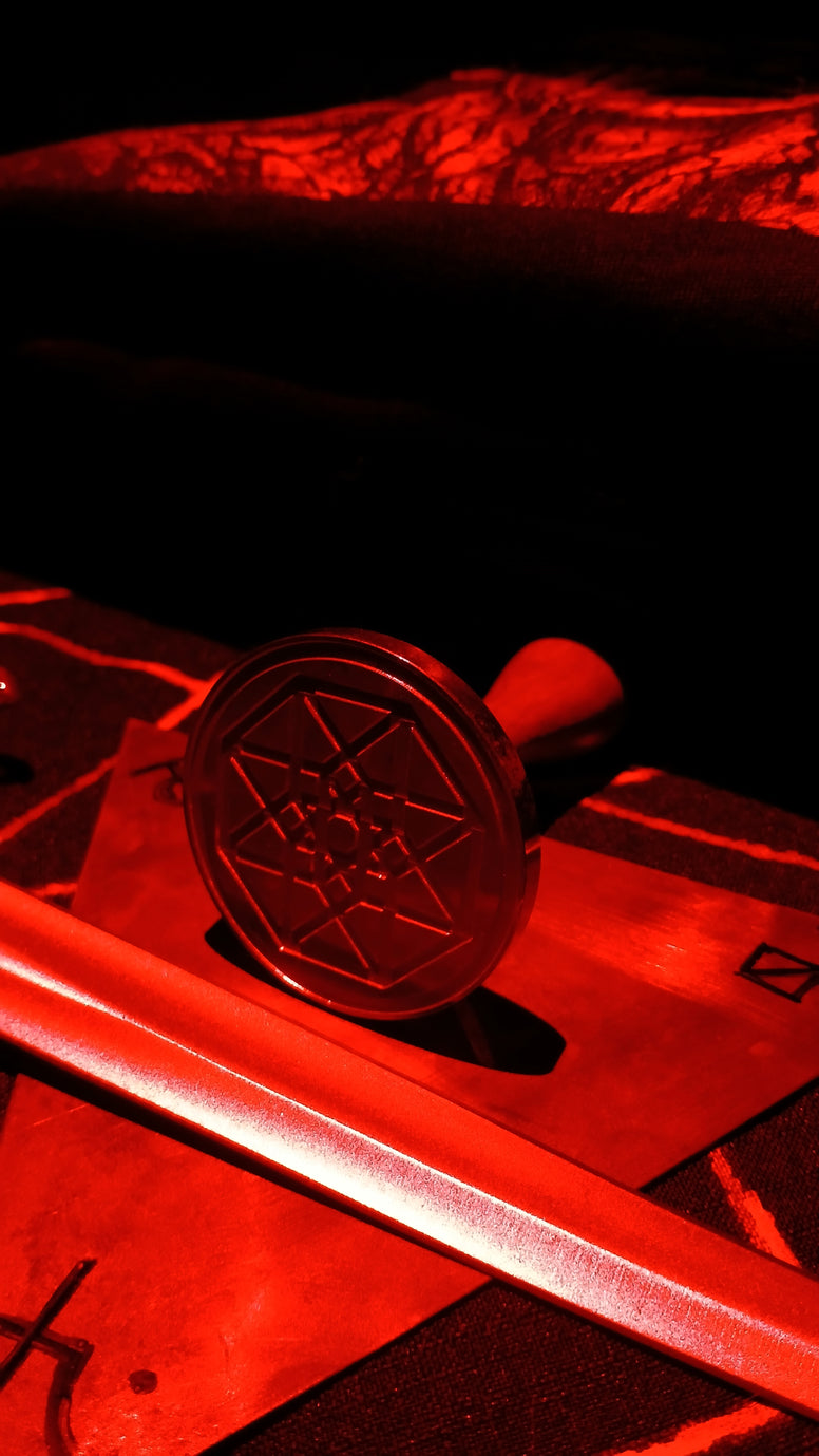 Ritual objects bathed in red light.